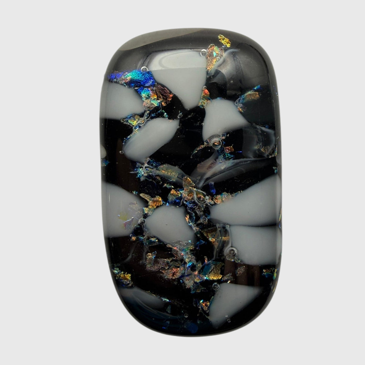 SunshineBeads handmade fused glass cabochon with black and white mosaic pattern and iridescent dichroic glass accents.