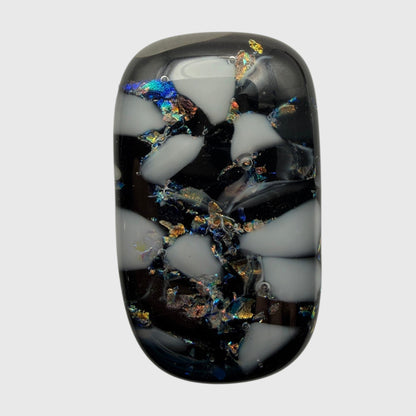 SunshineBeads handmade fused glass cabochon with black and white mosaic pattern and iridescent dichroic glass accents.